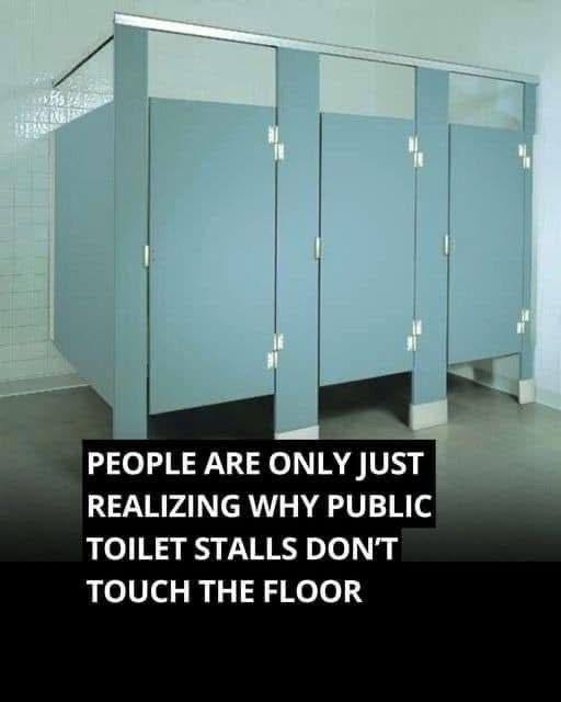Why do public bathroom doors not reach the floor?